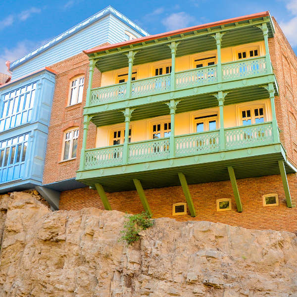 brick building green balcony